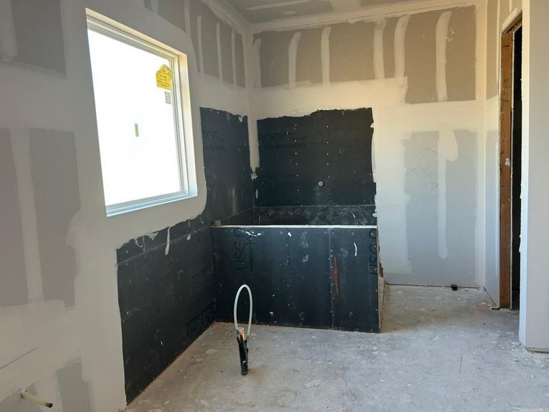 In-progress construction of a new home in The Grove at Blackhawk, Pflugerville, TX (Image 25).