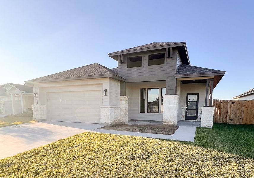 Front exterior of a new home in TerraVista, Victoria, TX, highlighting curb appeal (Image 22).