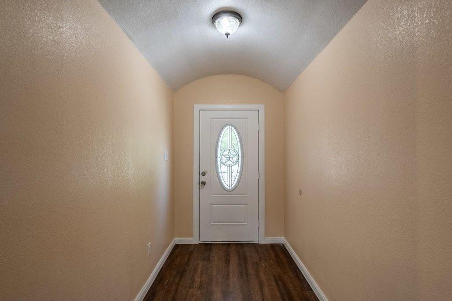 Barrell ceiling gives the entry a grand feel.