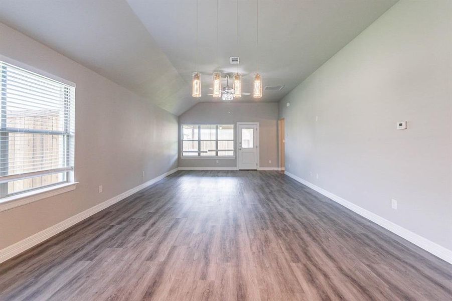 Open dining and living area- beautiful lighting