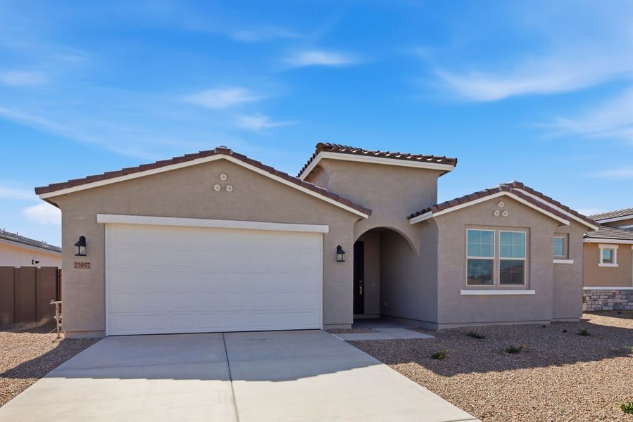 Front exterior of a new home in Montana Vista - Summit, Buckeye, AZ, highlighting curb appeal (Image 1). Front exterior of a new home in Montana Vista - Summit, Buckeye, AZ, highlighting curb appeal (Image 1).