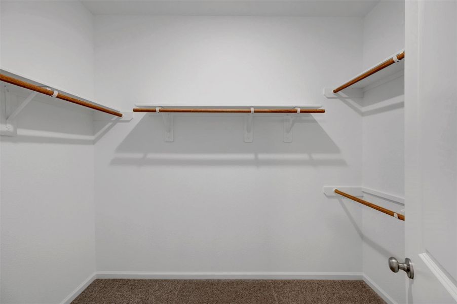 Primary walk-in closet Primary walk-in closet