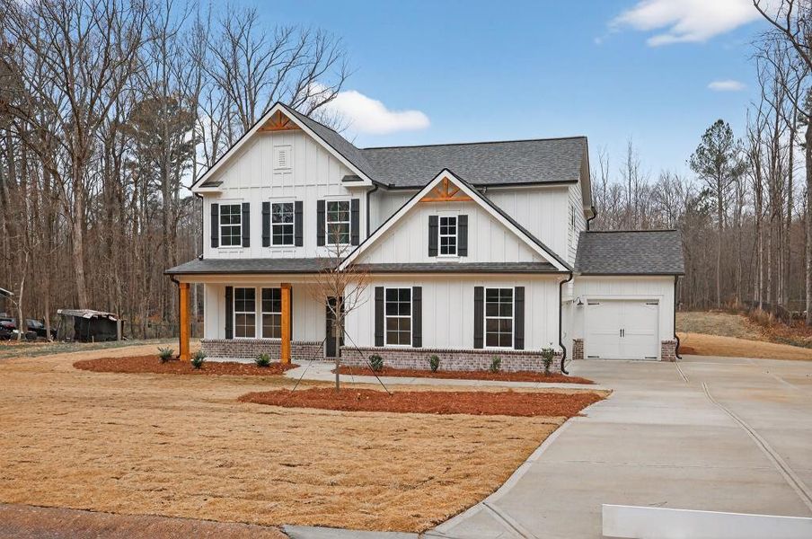 Front exterior of a new home in , Statham, GA, highlighting curb appeal (Image 25).
