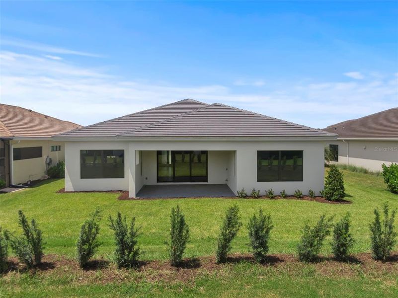 Front exterior of a new home in Cresswind Lakewood Ranch, Lakewood Ranch, FL, highlighting curb appeal (Image 19).