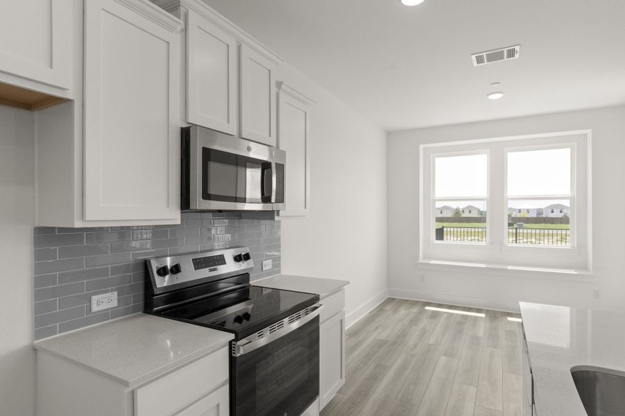 Furnished interior view inside a new home in Avery Centre, Round Rock (Image 9).