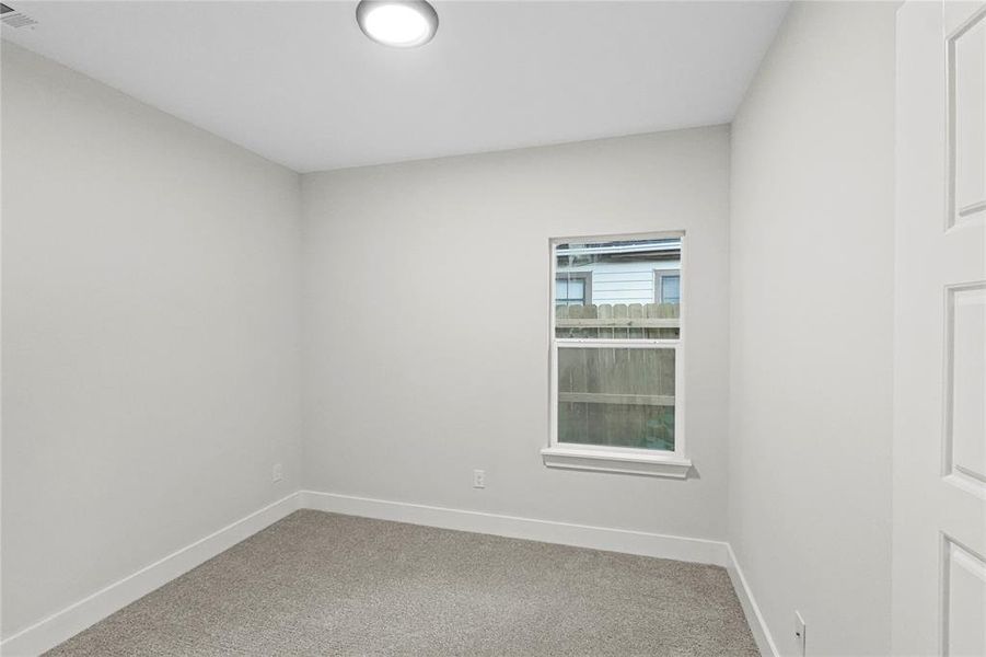 Empty room with carpet floors