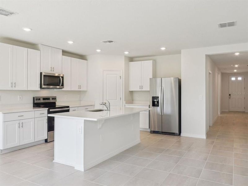 Furnished interior view inside a new home in The Reserve at Van Oaks, Auburndale (Image 10).