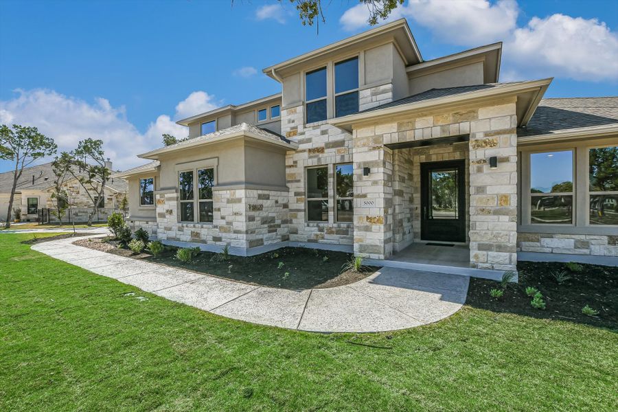 Representative exterior photo of a completed home built from the Vanderpool II by Giddens Homes in Whispering Wind, Bertram, TX (Image 31).