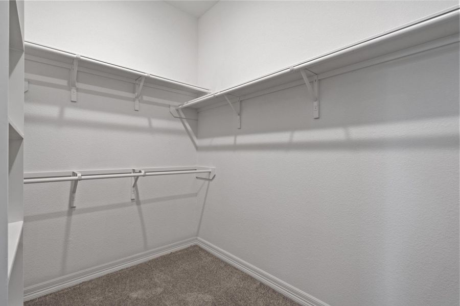 A view of your large primary walk-in Closet