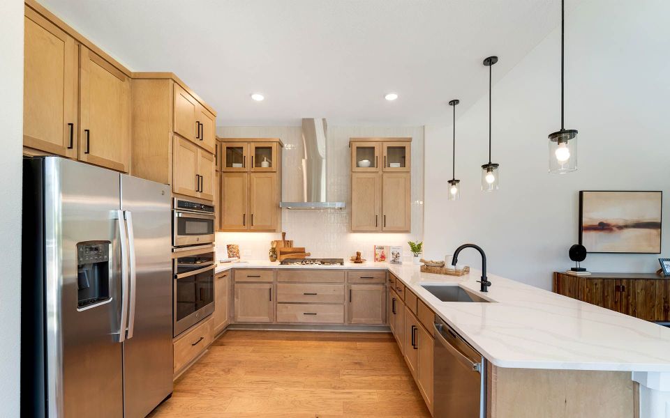 Representative furnished interior of a home built from the Rainier by CastleRock Communities in The Summit at Center Stage, Keller (Image 9).