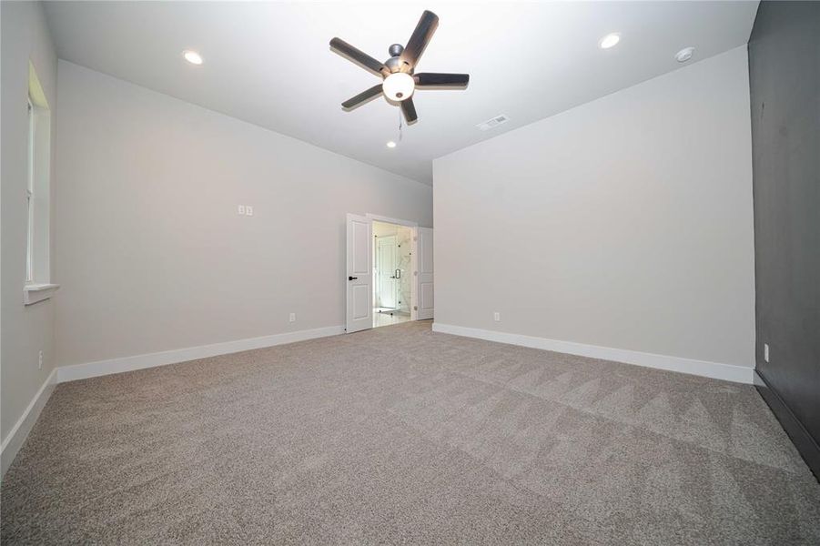 Unfurnished room with light colored carpet, recessed lighting, and ceiling fan Unfurnished room with light colored carpet, recessed lighting, and ceiling fan