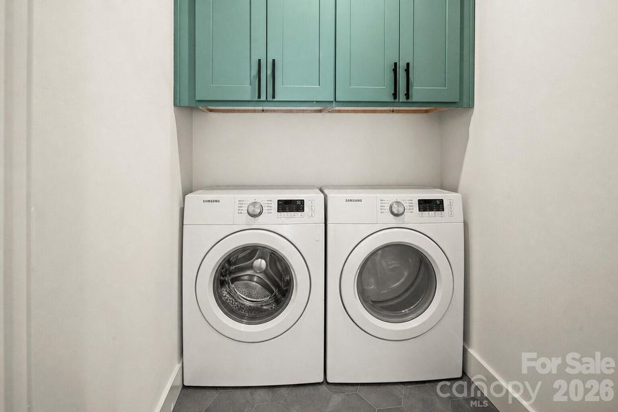 Virtually staged washer and dryer.