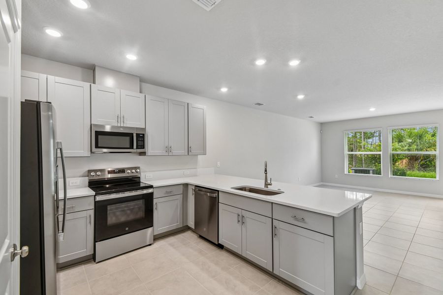 Furnished interior view inside a new home in Preserve at The Cays – The Harbor Series, Daytona Beach (Image 7).