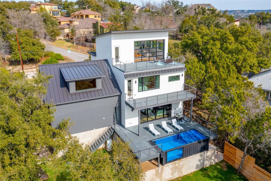 Rear view of house with an outdoor hangout area and a balcony