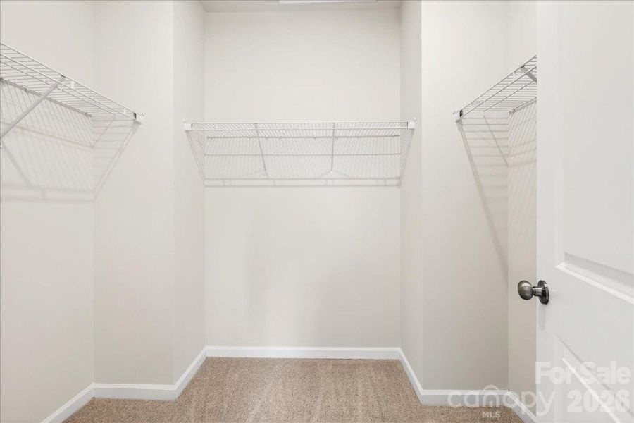 Primary walk-in closet Primary walk-in closet