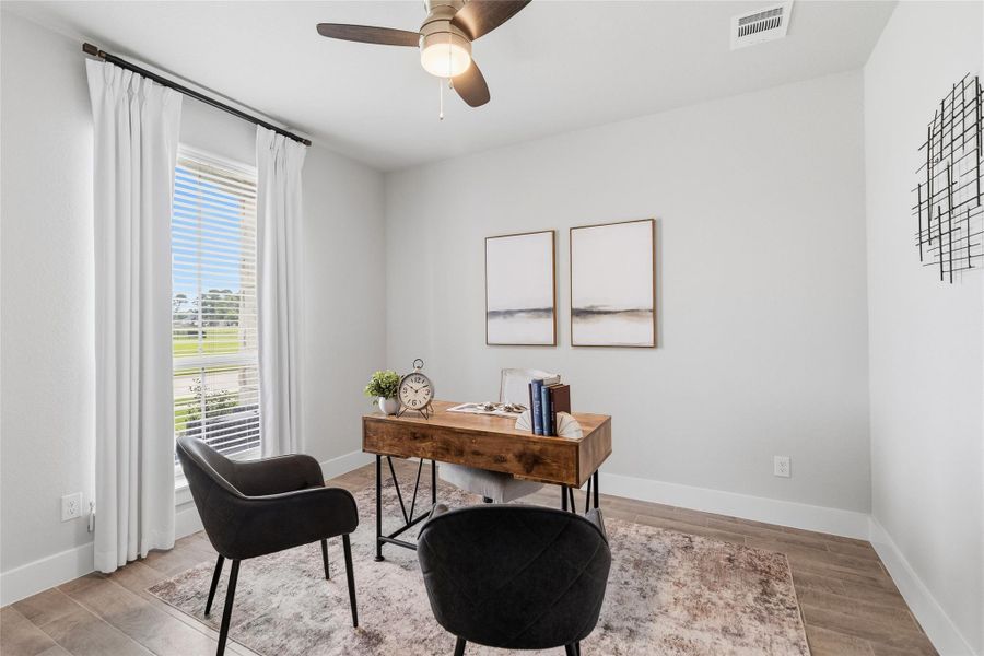 Your dedicated home office with large windows and abundant natural light offers the perfect space for remote work, studying, or a quiet reading retreat.