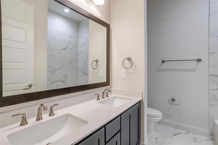 Bathroom with vanity and toilet