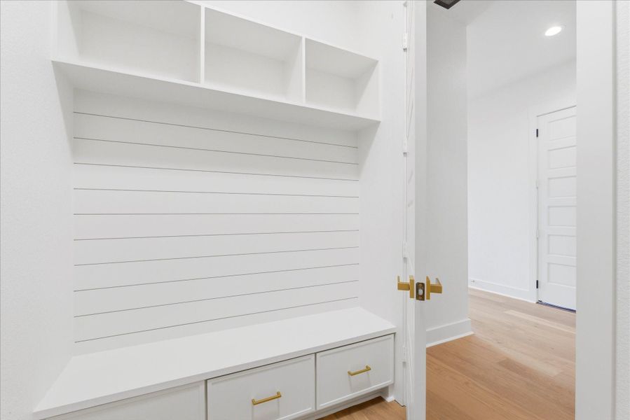 A combined laundry and mudroom offers a convenient, thoughtful use of space with plenty of storage and everyday functionality.