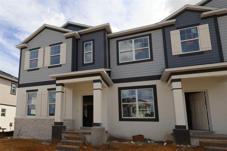 Exterior details and patio area of a home in Emerson Pointe, Apopka (Image 14). Exterior details and patio area of a home in Emerson Pointe, Apopka (Image 14).