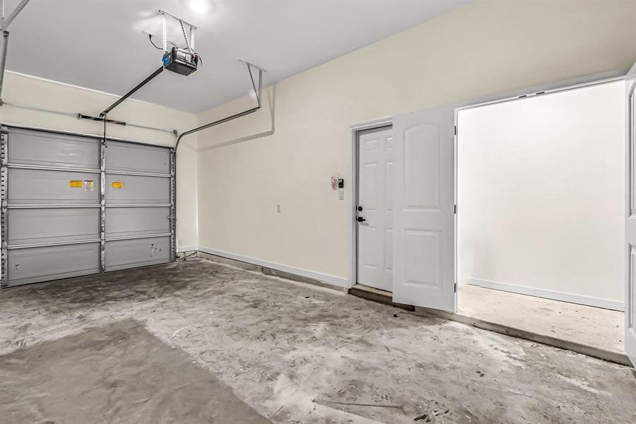 Garage space with double door storage closet.