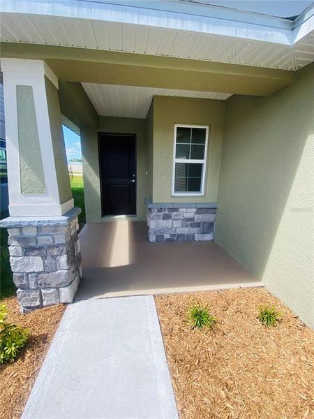 Front exterior of a new home in , St. Cloud, FL, highlighting curb appeal (Image 12).
