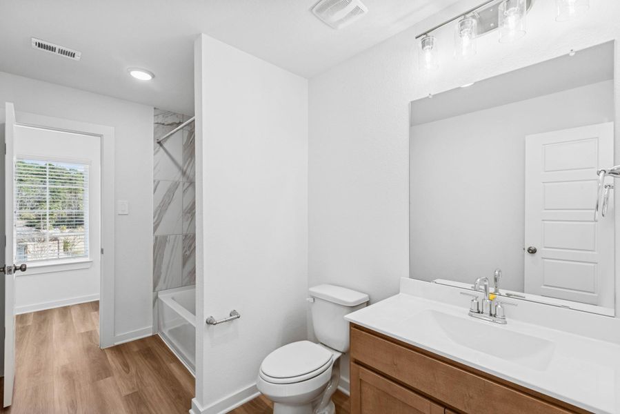 Furnished interior view inside a new home in Lone Star Landing, Montgomery (Image 13).