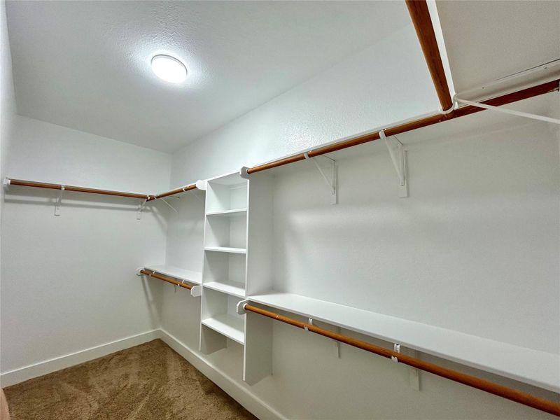 Primary walk-in closet by the primary bedroom