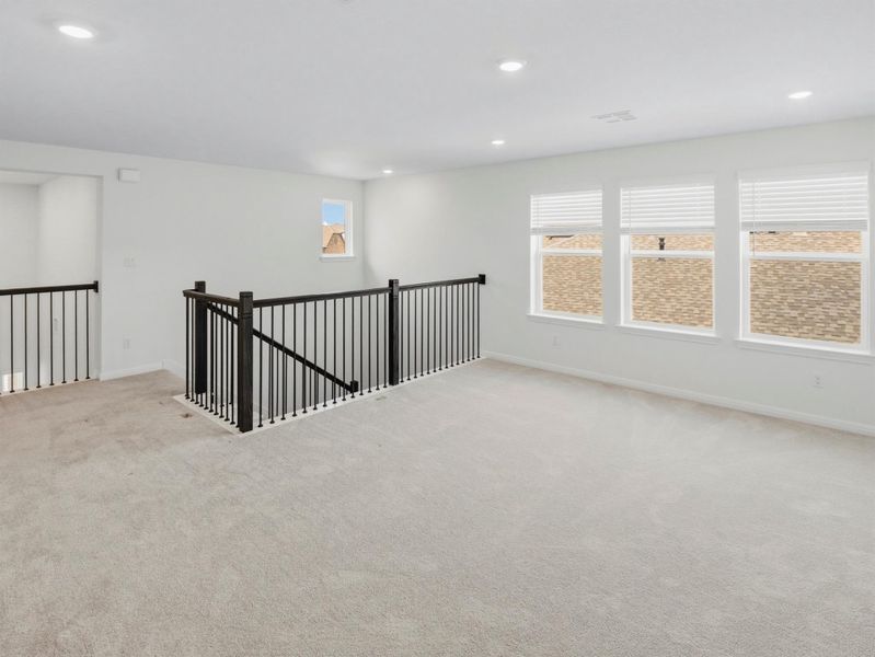 A spacious, naturally illuminated loft provides versatile living options. A spacious, naturally illuminated loft provides versatile living options.