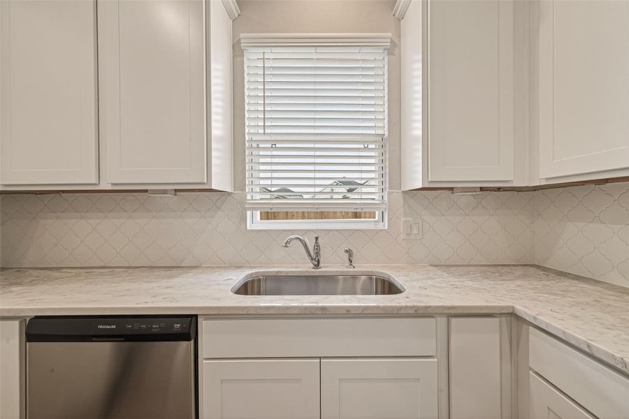 Close-up of interior finishes inside a home in Sunterra, Katy (Image 17).
