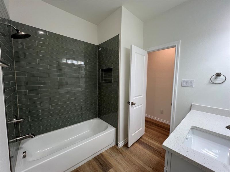 Full bathroom featuring vanity, Tile surround tub / shower