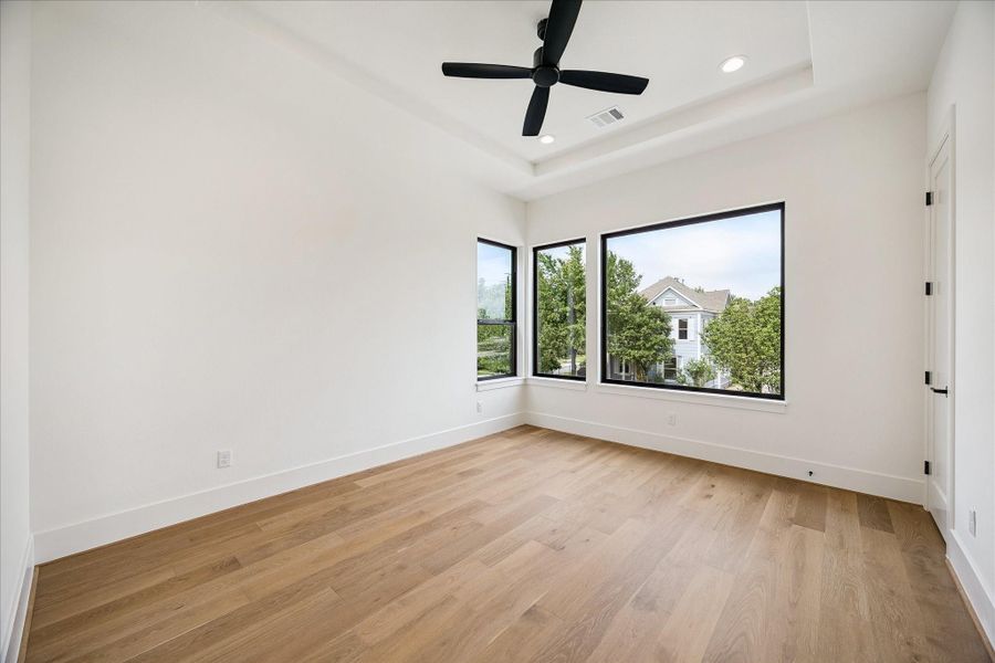 Bedroom #5 - features tray ceiling, ceiling fan, walk-in closet, and an en-suite bath. Bedroom #5 - features tray ceiling, ceiling fan, walk-in closet, and an en-suite bath.