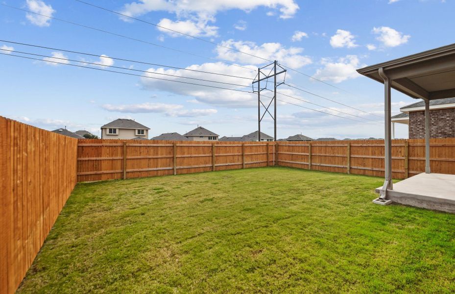Exterior details and patio area of a home in Crosswinds, Kyle (Image 3).