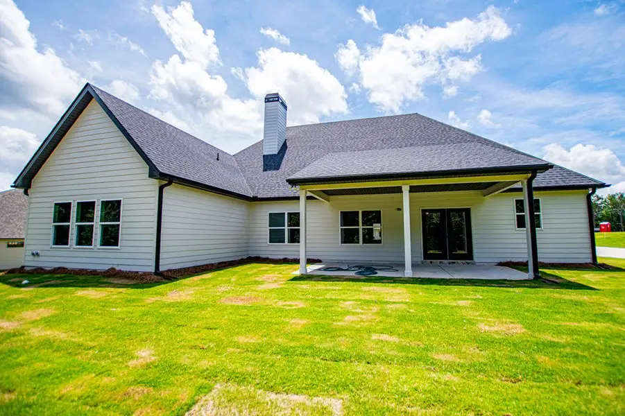 Exterior details and patio area of a home in WOODMONT RESERVE, Roopville (Image 4).