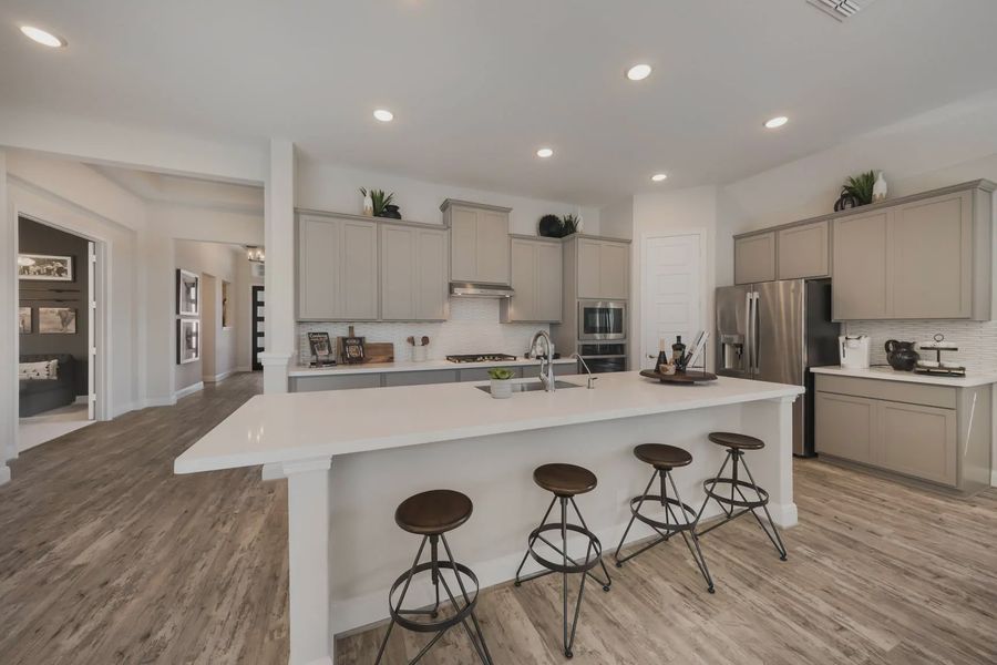 Representative furnished interior of a home built from the Mackenzie by Chesmar Homes in The Reserve at Potranco Oaks, Castroville (Image 5).