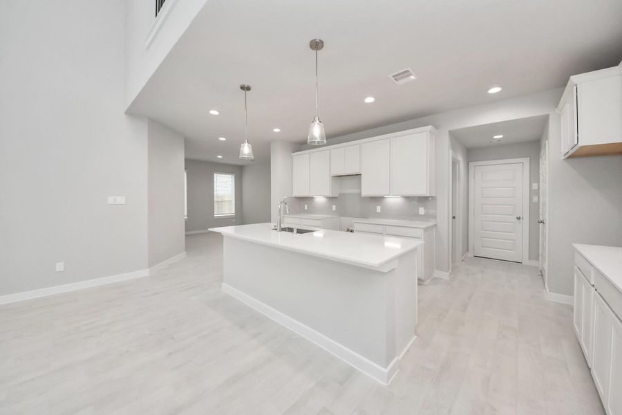 This generously spacious kitchen is a dream realized! Sample photo of completed home with similar floor plan. Actual colors and selections may vary. This generously spacious kitchen is a dream realized! Sample photo of completed home with similar floor plan. Actual colors and selections may vary.
