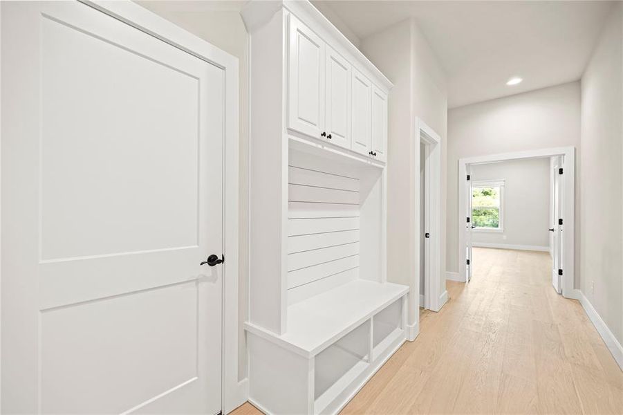 Mudroom with light wood-style flooring and recessed lighting Mudroom with light wood-style flooring and recessed lighting