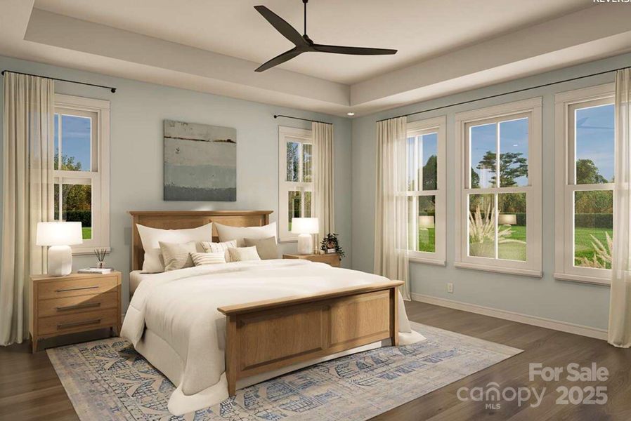This spacious primary bedroom features a tray ceiling and expansive windows that flood the room with natural light and frame serene outdoor views. This spacious primary bedroom features a tray ceiling and expansive windows that flood the room with natural light and frame serene outdoor views.