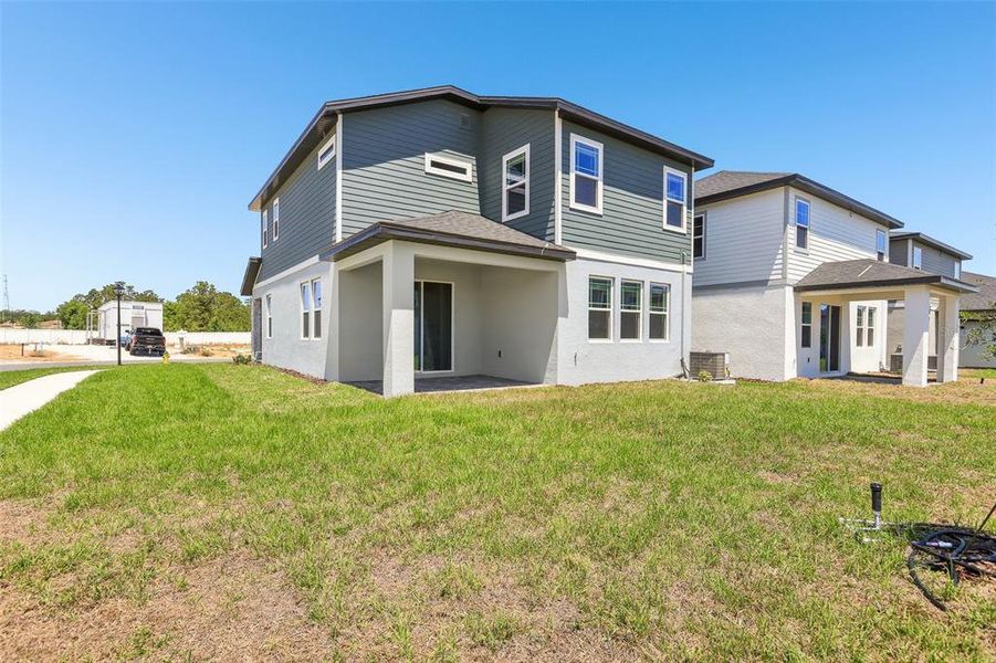 Exterior details and patio area of a home in Cyrene at Minneola - Villas, Montverde (Image 20).