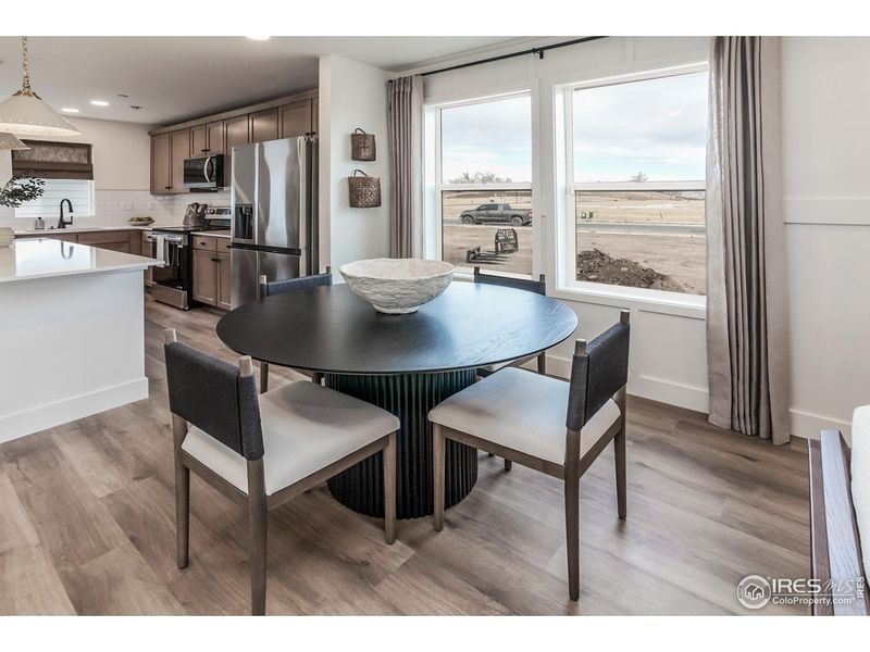 Furnished interior view inside a new home in Prairie Song Story Collection - Single Family Homes, Windsor (Image 4).