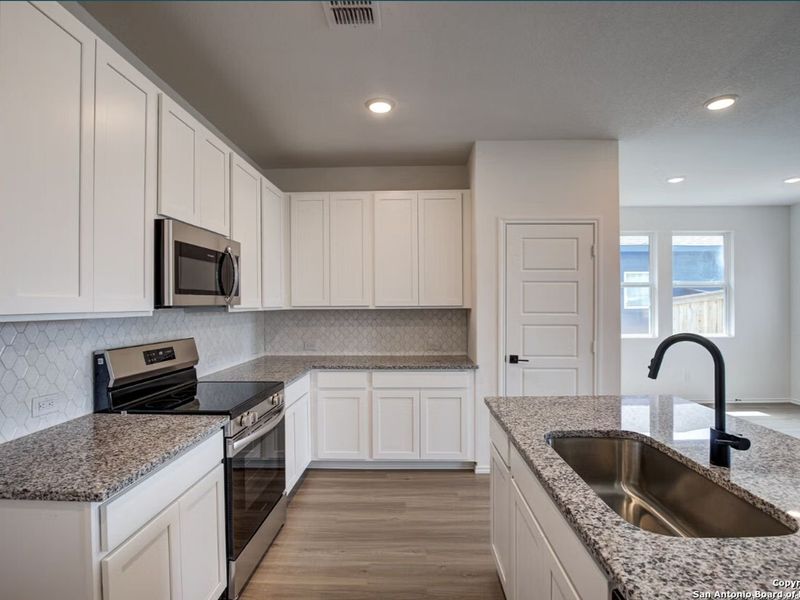 Furnished interior view inside a new home in Hannah Heights, Seguin (Image 5).