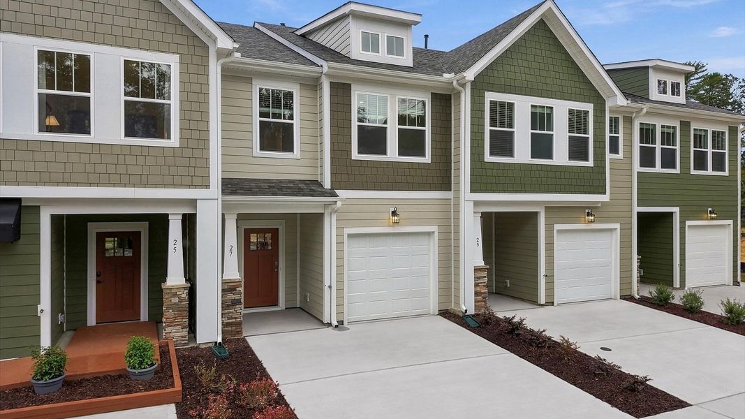 Front exterior of a new home in Brookland Place, Hendersonville, NC, highlighting curb appeal (Image 2). Front exterior of a new home in Brookland Place, Hendersonville, NC, highlighting curb appeal (Image 2).