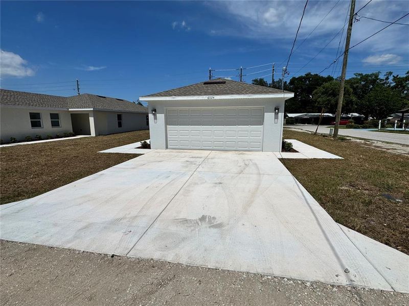 Front exterior of a new home in , Zephyrhills, FL, highlighting curb appeal (Image 27). Front exterior of a new home in , Zephyrhills, FL, highlighting curb appeal (Image 27).