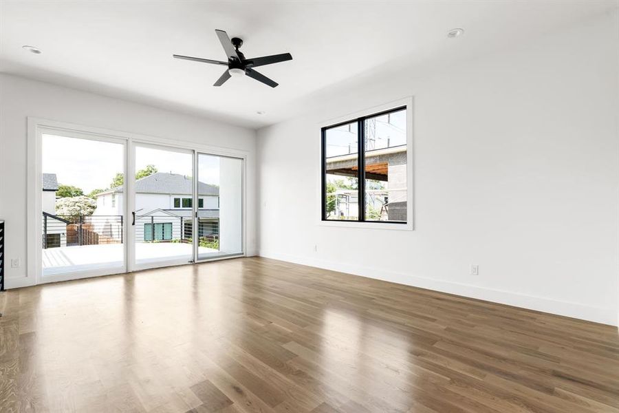 Spare room with a ceiling fan and wood finished floors Spare room with a ceiling fan and wood finished floors