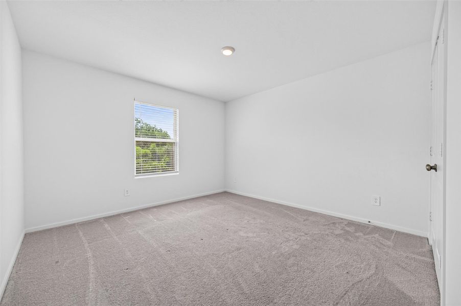 Secondary bedroom has carpet. Secondary bedroom has carpet.