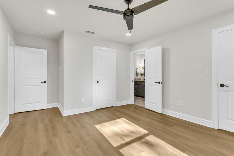 Unfurnished bedroom featuring recessed lighting, light wood-type flooring, and a ceiling fan Unfurnished bedroom featuring recessed lighting, light wood-type flooring, and a ceiling fan