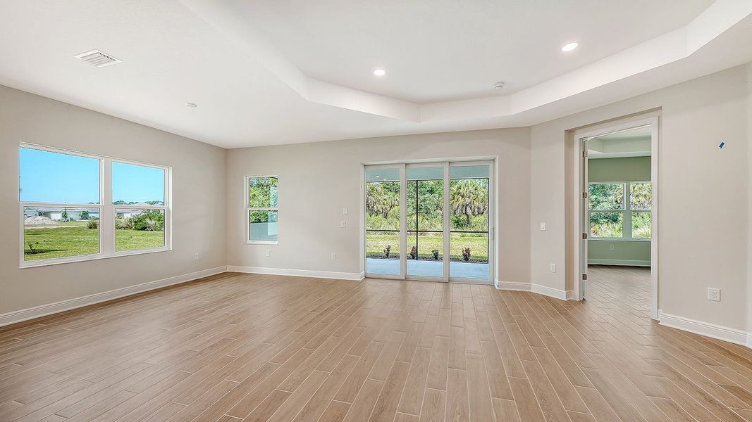 Spacious, unfurnished interior of a new home in Grand Park Real Estate and Homes for Sale in Sarasota, FL - Neal Communities, Sarasota (Image 30).