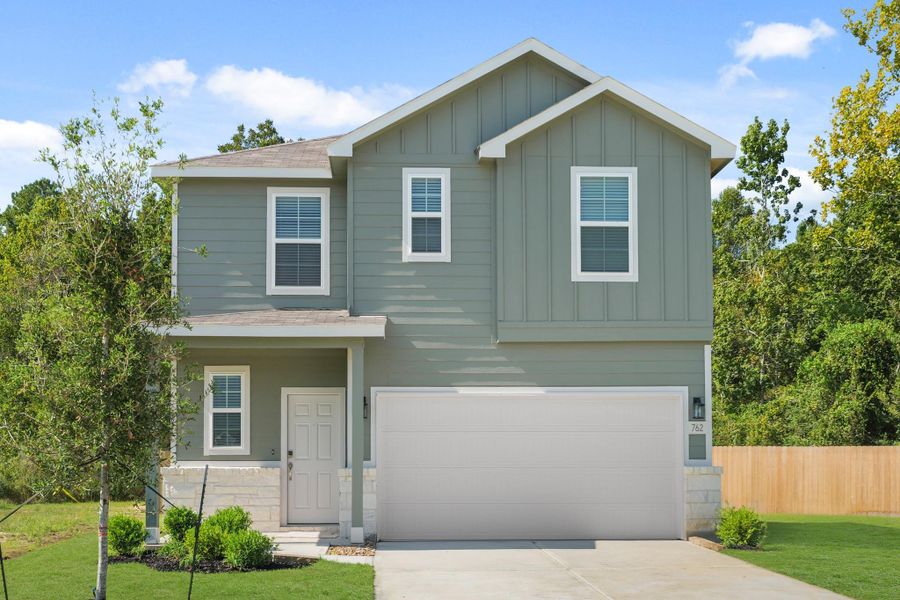 Front exterior of a new home in The Villages at Westpointe, Dayton, TX, highlighting curb appeal (Image 2).