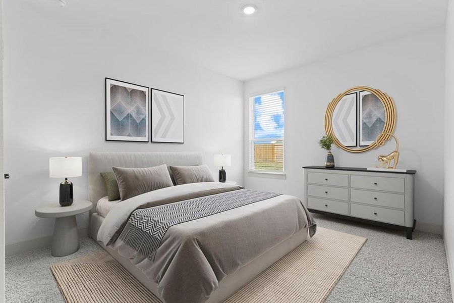 Comfortable guest bedroom featuring neutral-toned walls, carpeted flooring, and a separate closet. Comfortable guest bedroom featuring neutral-toned walls, carpeted flooring, and a separate closet.