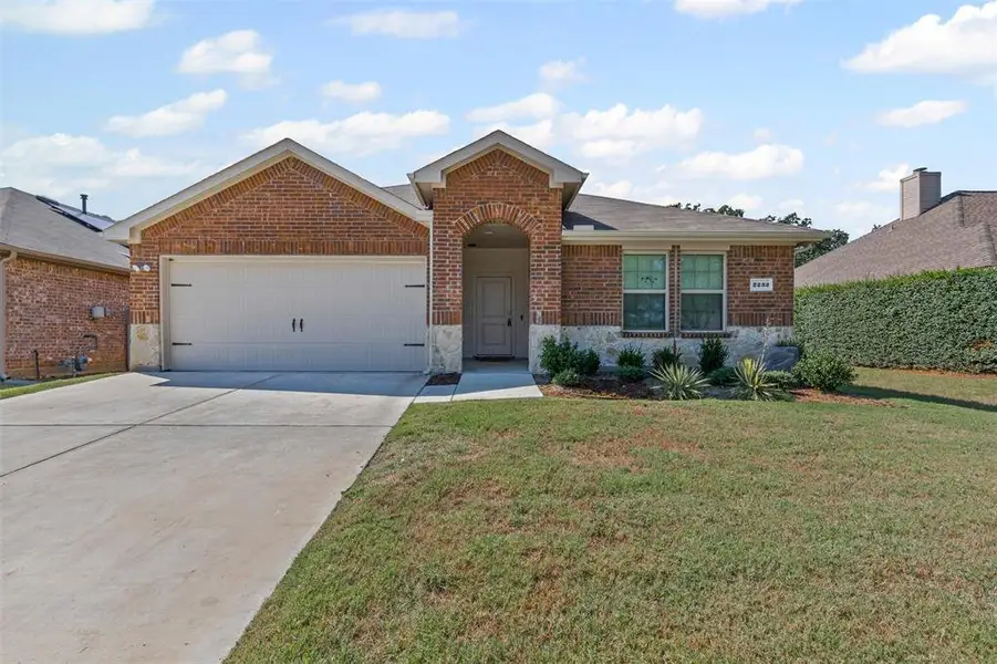 Beautiful brick and stone single-story home with charming curb appeal, manicured landscaping, and a spacious two-car garage in a quiet neighborhood. Beautiful brick and stone single-story home with charming curb appeal, manicured landscaping, and a spacious two-car garage in a quiet neighborhood.
