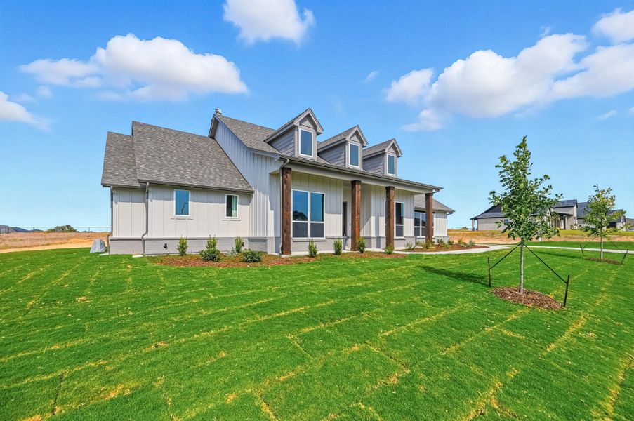 Front exterior of a new home in Rocky Top Ranch, Reno, TX, highlighting curb appeal (Image 19). Front exterior of a new home in Rocky Top Ranch, Reno, TX, highlighting curb appeal (Image 19).